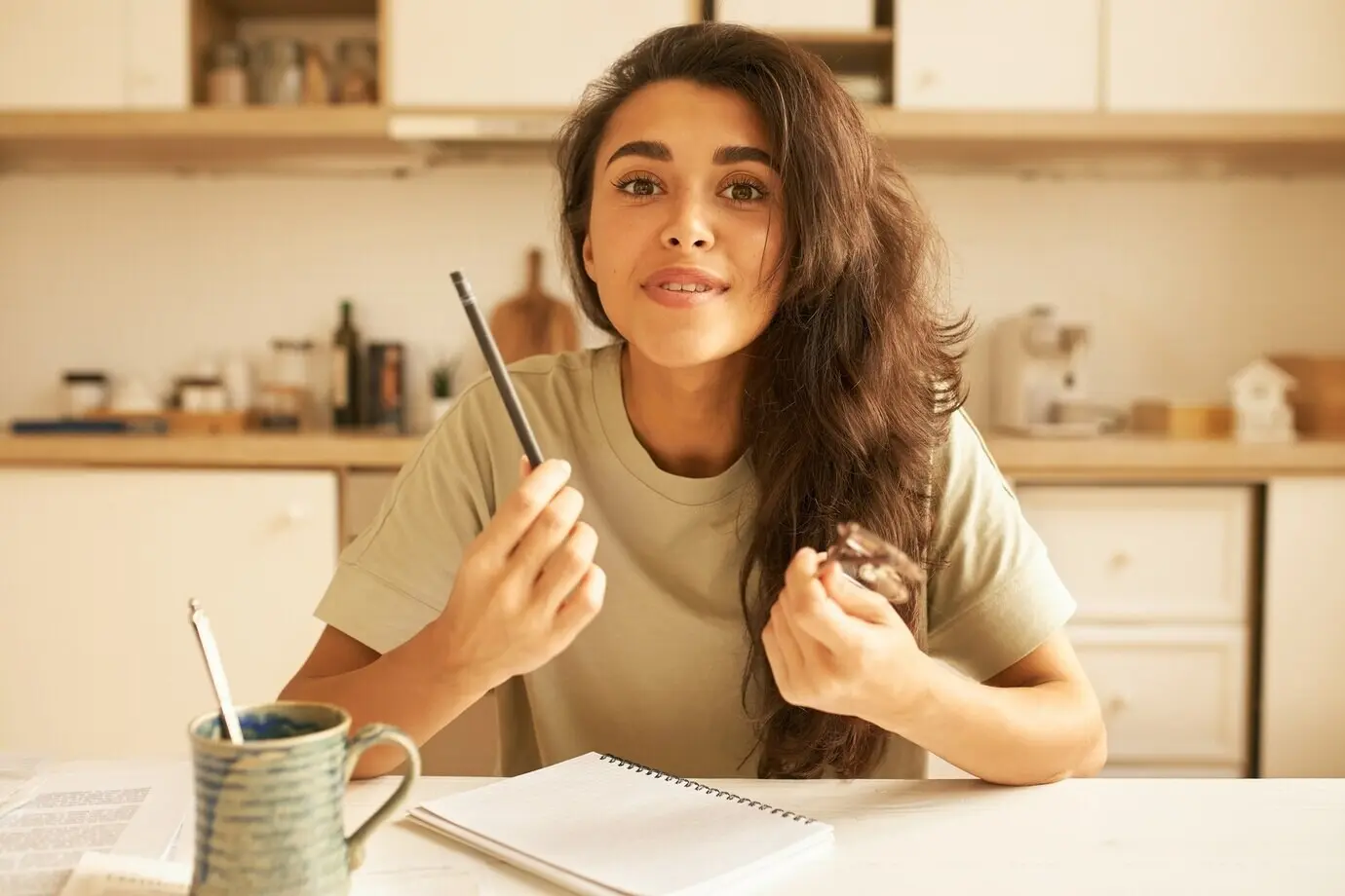 A cute young female posing indoors.