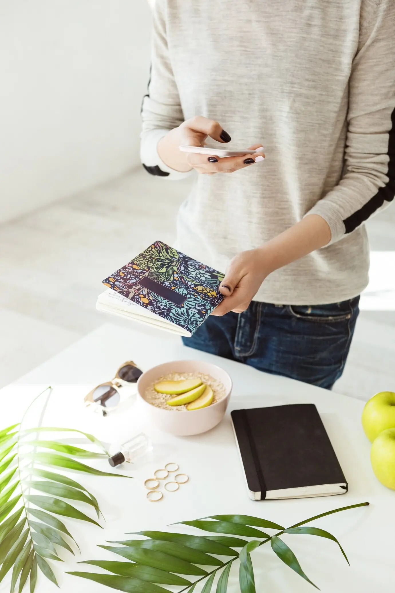 Cropped shot of a girl in casual wear taking stylish photos.